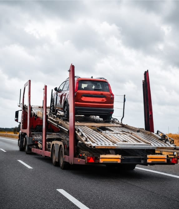 Red car carrier truck operating as Local breakdown recovery Specialists Trusted in Sutton Coldfield
