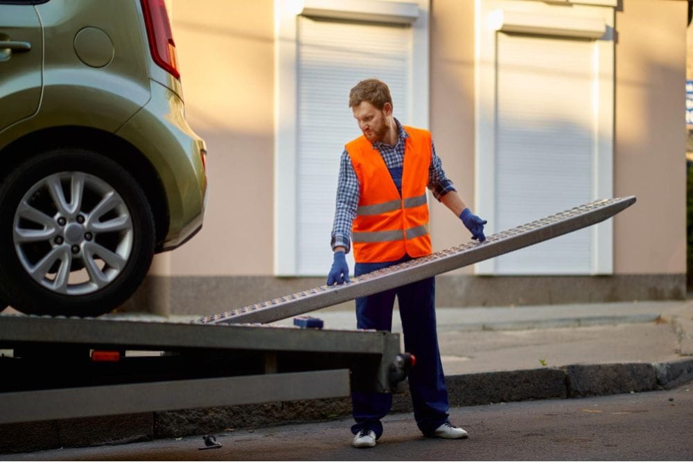 Technician prepares loading ramp showing how our breakdown recovery works in Sandwell