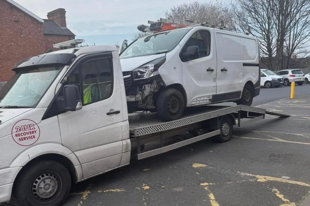 White flatbed tow truck providing car breakdown recovery service Edgbaston