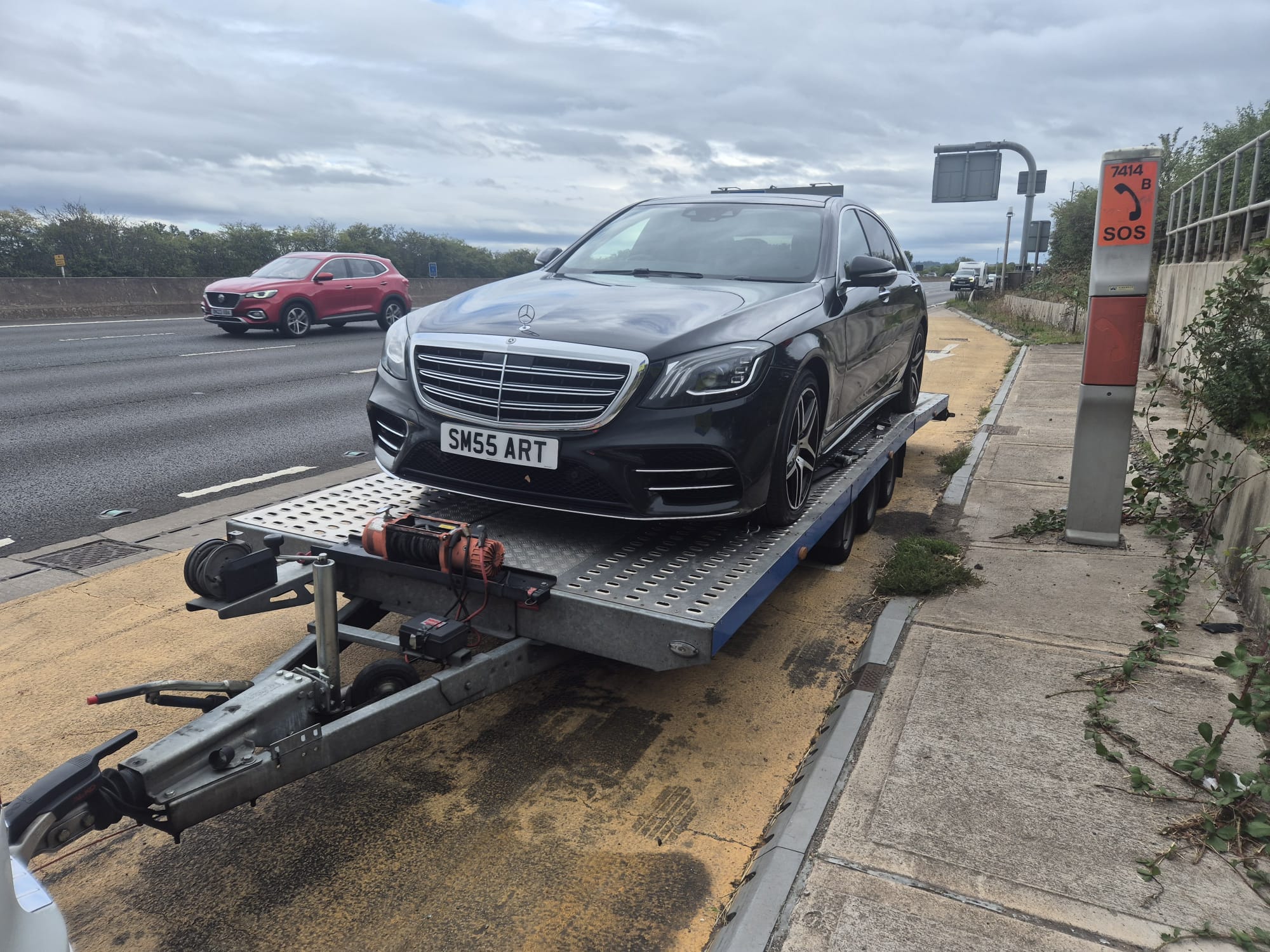 Mercedes-Benz S-Class secured on a flatbed recovery trailer